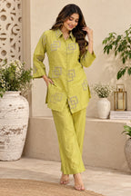 Pistachio green embroidered shirt with collar and geometric detailing