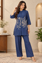 Navy blue shirt-style top with abstract geometric embroidery and mandarin collar