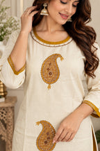 Ivory straight kurta with paisley embroidery and mustard border detailing