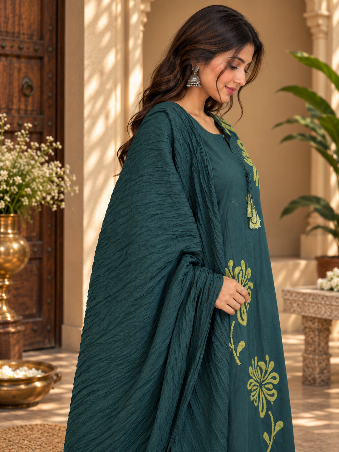 Teal green straight kurta with olive-gold embroidered hem