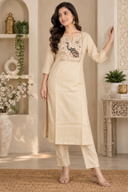 Cream embroidered kurta with matching straight pants and pink bordered dupatta