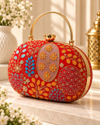Embroidered round clutch bag for women with multicolor floral traditional pattern and gold handle