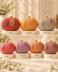 Embroidered round clutch bag for women with multicolor floral traditional pattern and gold handle
