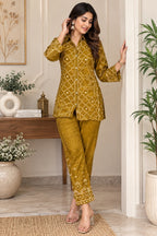 Mustard yellow shirt-style top with geometric print and full sleeves