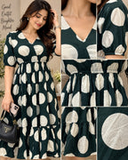 Dark green midi dress with ivory polka dots, V-neck and puff sleeves