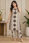 Beige printed kurta pant set with geometric diamond motifs and tassels