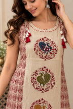 Beige sleeveless straight kurta with floral paisley print and tassels