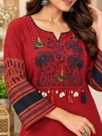 Maroon straight kurta with floral bird embroidery and tassel detailing