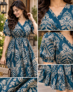 Teal blue midi dress with ivory ornamental print, V-neck and puff sleeves